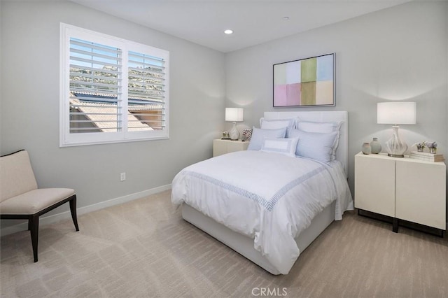 bedroom featuring light colored carpet