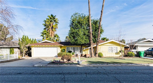 ranch-style house with a front lawn and a garage