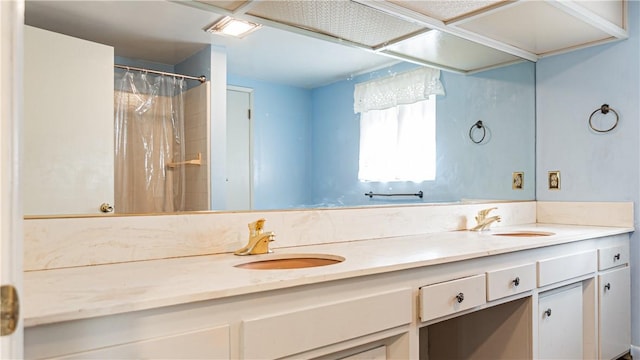 bathroom with vanity and curtained shower