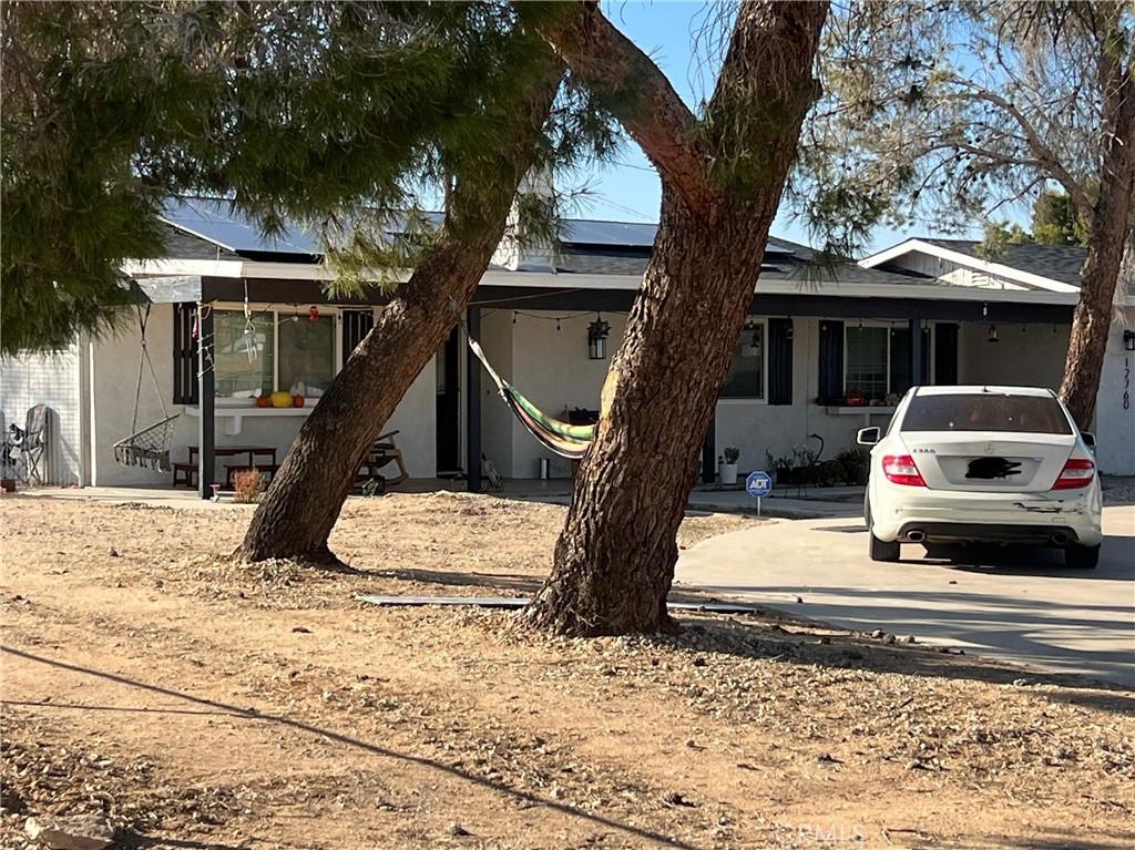 view of front of home with a carport