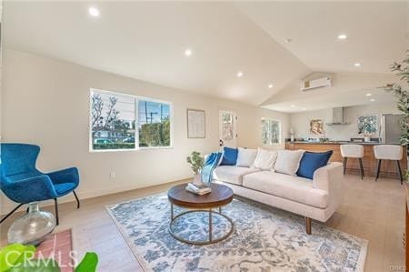 living room with light wood-type flooring and lofted ceiling