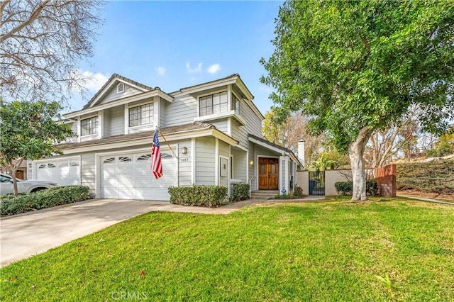 front of property featuring a front lawn and a garage