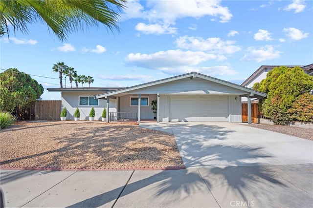 ranch-style home with a garage and a porch