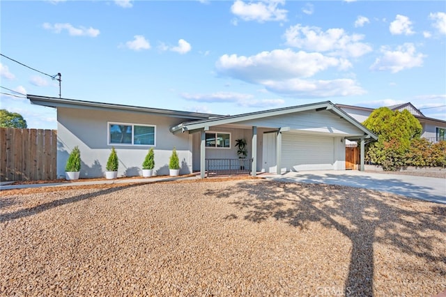 ranch-style home featuring a garage