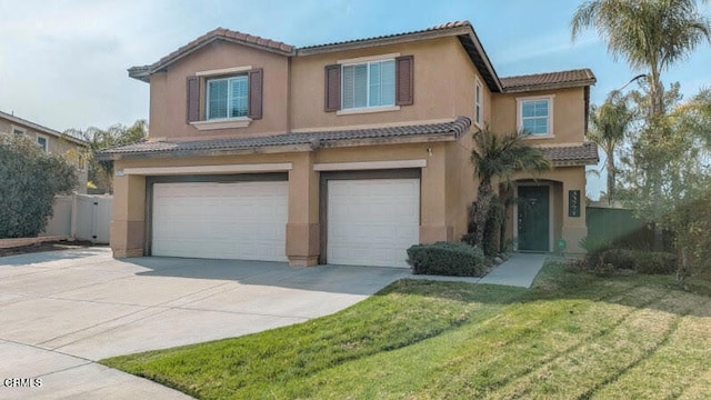 view of front of property featuring concrete driveway, a front lawn, an attached garage, and stucco siding