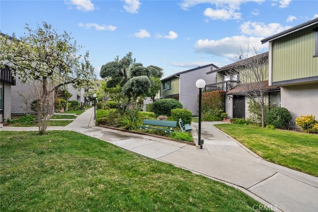 view of property's community featuring a yard