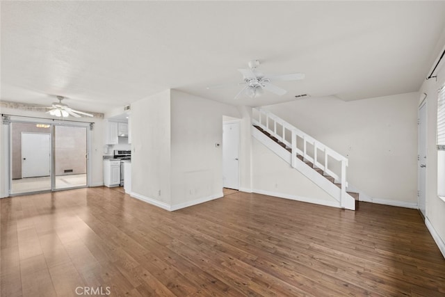 unfurnished living room featuring ceiling fan and wood-type flooring