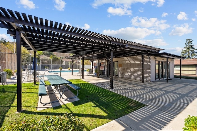 view of community featuring a patio area, a lawn, a pergola, and a pool