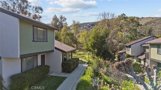 view of side of property featuring a mountain view