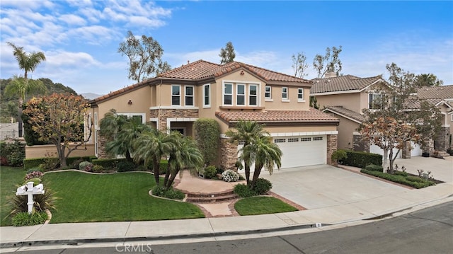 mediterranean / spanish home with stone siding, concrete driveway, and stucco siding