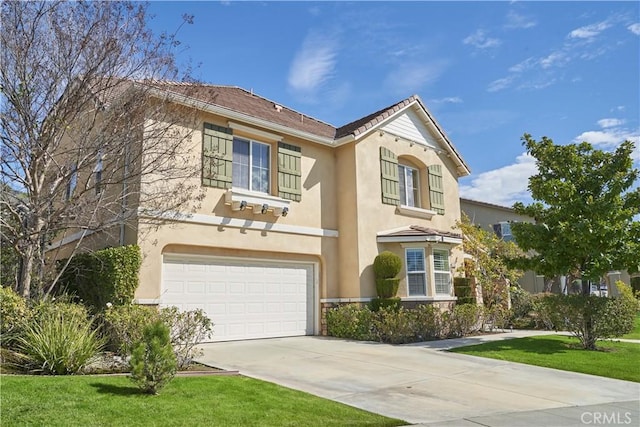 view of front of house with a garage and a front lawn