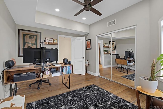 office space featuring ceiling fan and wood-type flooring