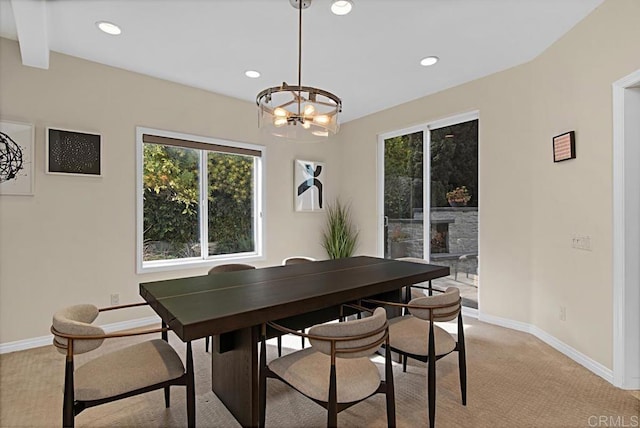 dining space with a notable chandelier