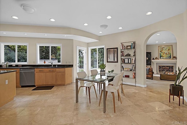 dining area featuring sink and a wealth of natural light