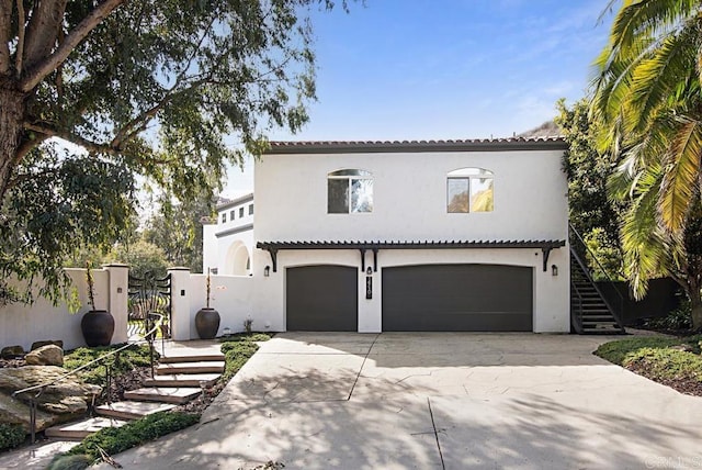 mediterranean / spanish house featuring a garage