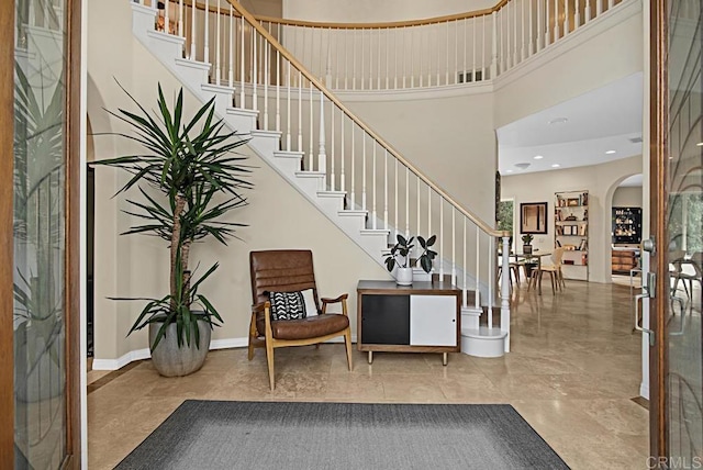 foyer with a towering ceiling