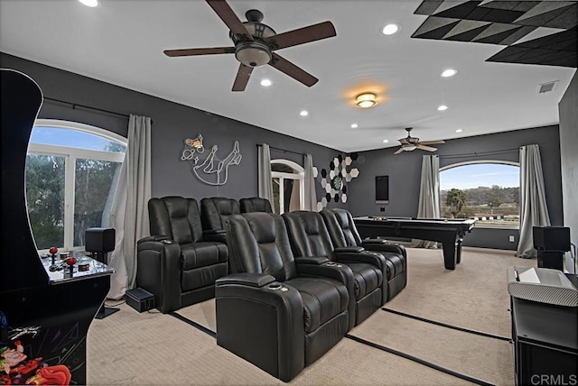 carpeted home theater room with billiards and a wealth of natural light