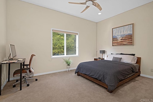 bedroom featuring ceiling fan and light colored carpet