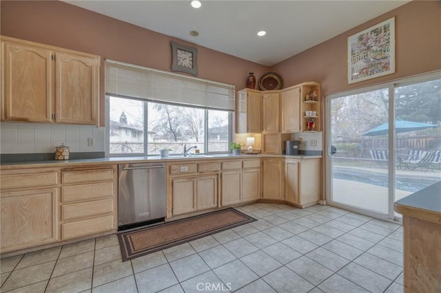 kitchen featuring light brown cabinetry, backsplash, and dishwasher