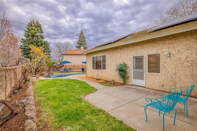 view of yard with a patio, a fenced backyard, and a fenced in pool