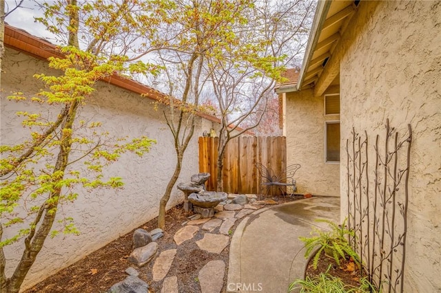 view of patio featuring fence