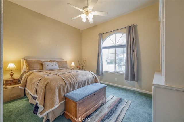 carpeted bedroom featuring baseboards and a ceiling fan