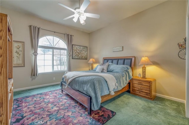 carpeted bedroom featuring a ceiling fan and baseboards