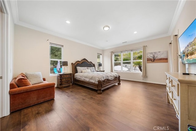 bedroom with ornamental molding and dark wood-style flooring