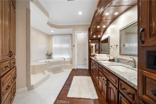 full bath featuring ornamental molding, tile patterned floors, vanity, a bath, and recessed lighting