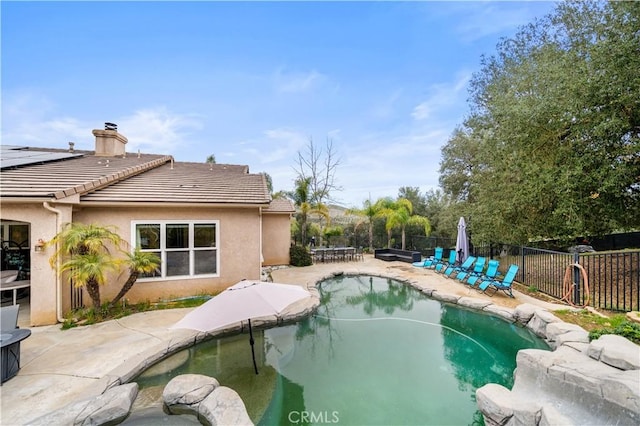 view of swimming pool featuring a fenced backyard, a fenced in pool, and a patio