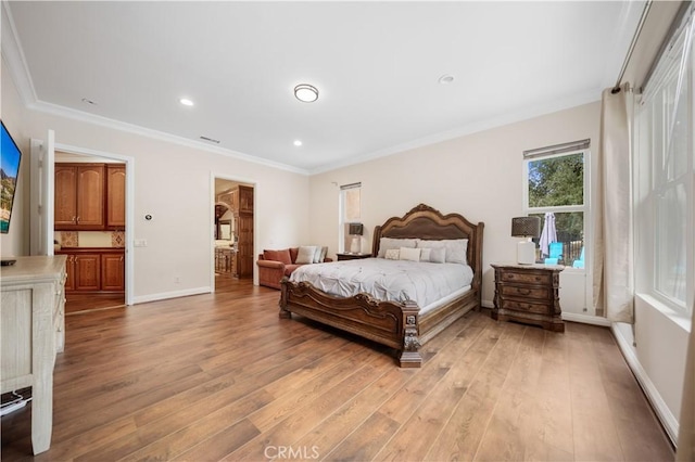 bedroom with ornamental molding, light wood finished floors, recessed lighting, and baseboards