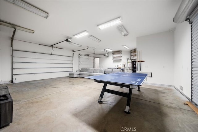 playroom featuring a garage and concrete floors