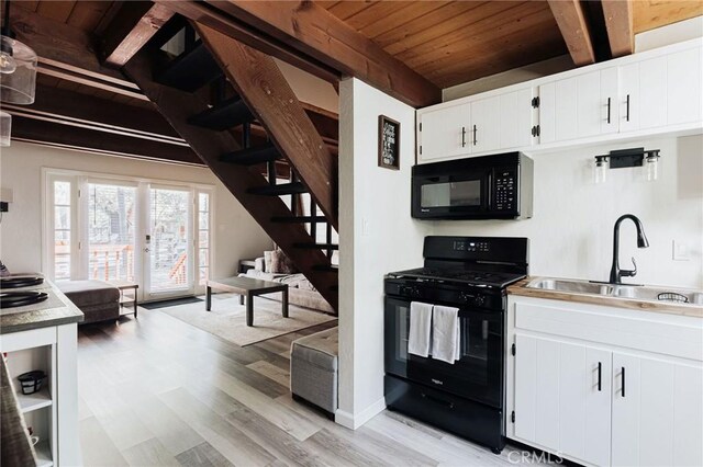 396 Kern Ave, Sugarloaf, CA 92386 - kitchen featuring sink, black appliances, white cabinets, wood ceiling, and beam ceiling