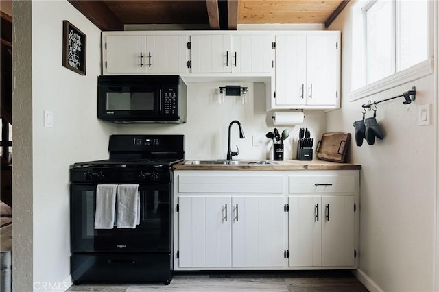396 Kern Ave, Sugarloaf, CA 92386 - kitchen with hardwood / wood-style flooring, wood ceiling, black appliances, sink, and white cabinets