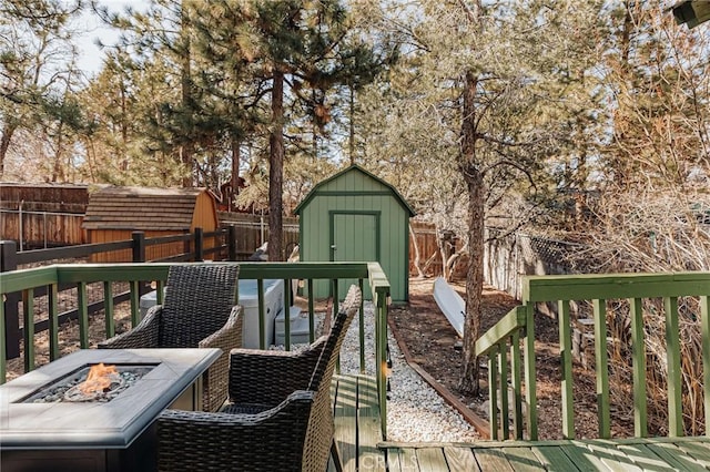396 Kern Ave, Sugarloaf, CA 92386 - wooden deck with a storage shed and a fire pit