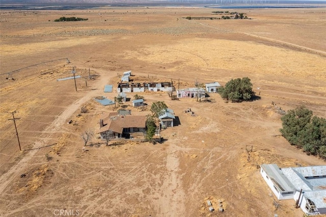 birds eye view of property with a rural view