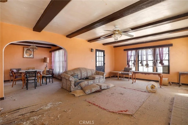 living room with beamed ceiling and ceiling fan