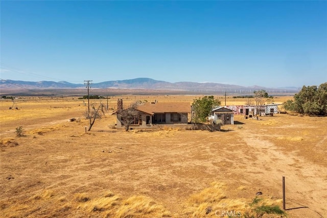 view of mountain feature with a rural view