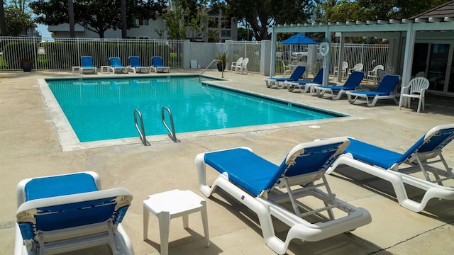 view of swimming pool featuring a pergola and a patio area