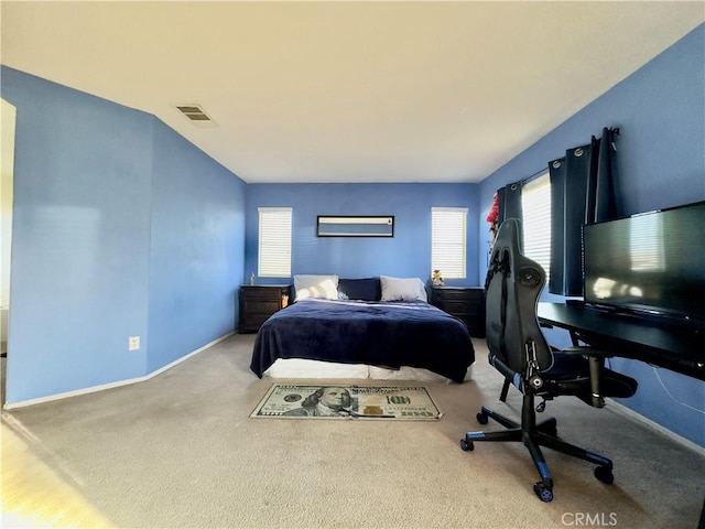 bedroom with carpet flooring, visible vents, and baseboards