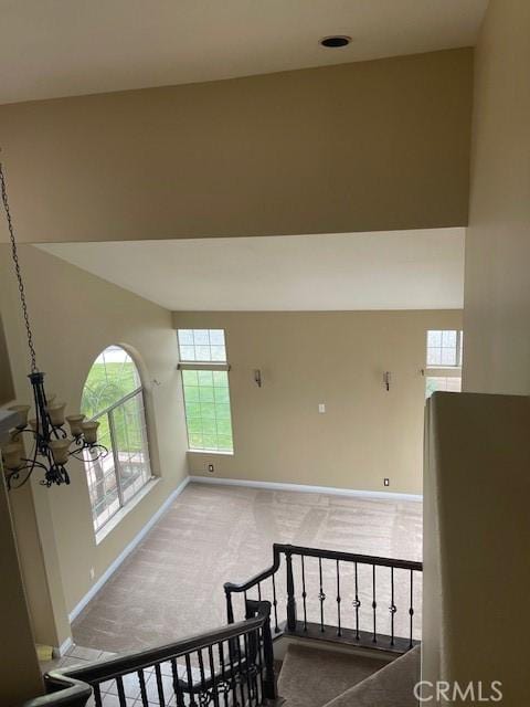 interior space with carpet flooring and baseboards