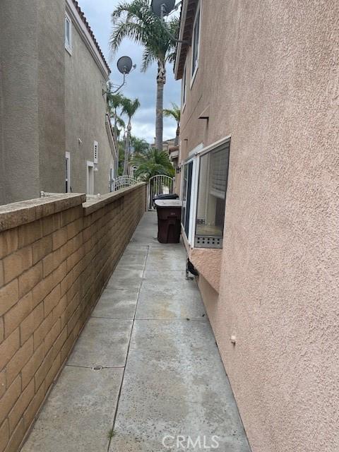 view of side of property featuring stucco siding