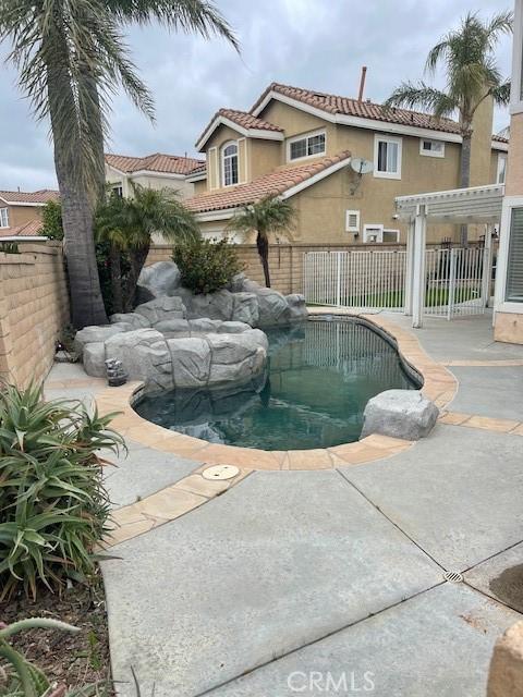 view of swimming pool with a fenced backyard, a patio, and a fenced in pool