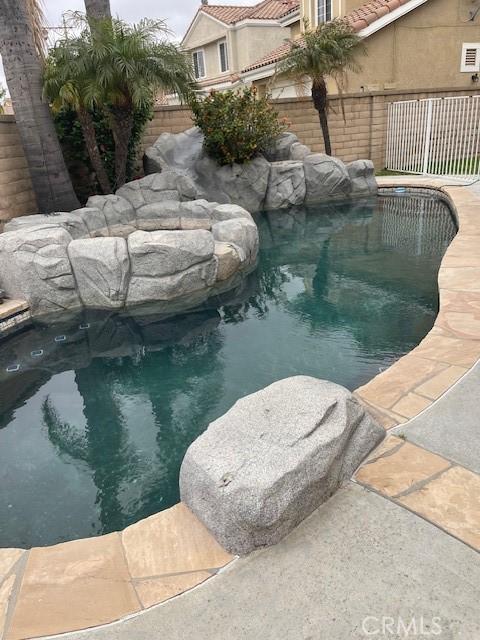view of pool with a fenced backyard and a fenced in pool