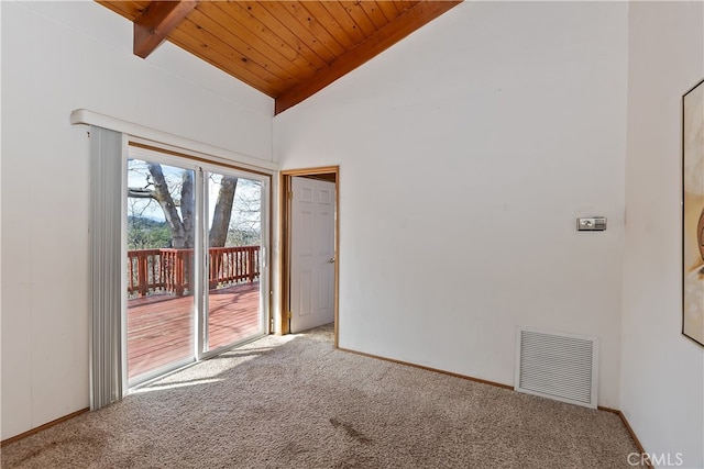 carpeted empty room featuring vaulted ceiling with beams and wooden ceiling