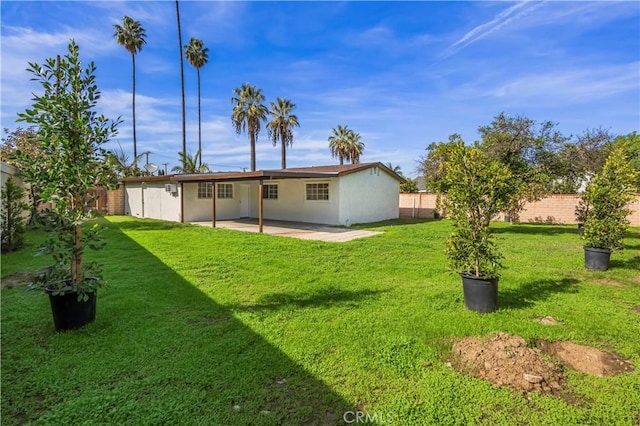 view of yard with a fenced backyard and a patio