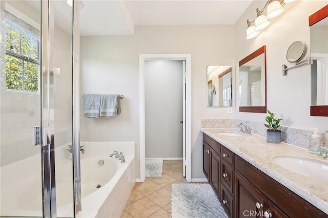 bathroom with tile patterned flooring, a sink, a shower stall, and a bath