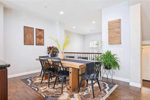 dining space featuring baseboards, dark wood-style flooring, and recessed lighting