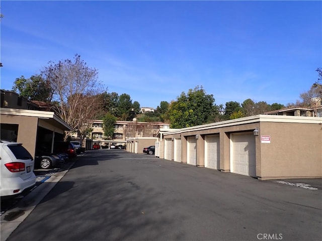 view of road with community garages