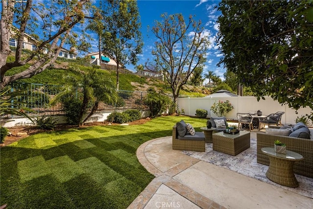 view of yard with an outdoor hangout area, a patio, and a fenced backyard